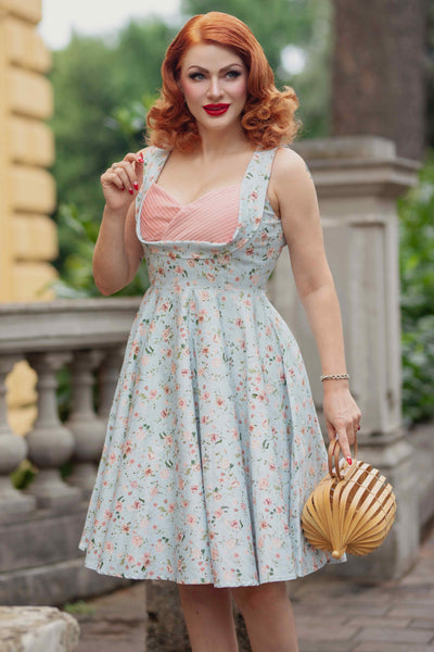 A model wearing a Pleated Bust Dress in Baby Blue/Pink Floral Print