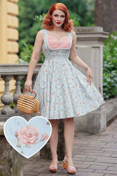 A model wearing a Pleated Bust Dress in Baby Blue/Pink Floral Print