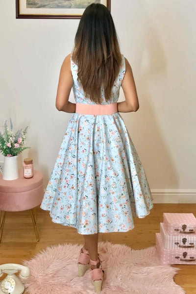 A model wearing Pleated Bust Dress in Baby Blue/Pink Floral Print
