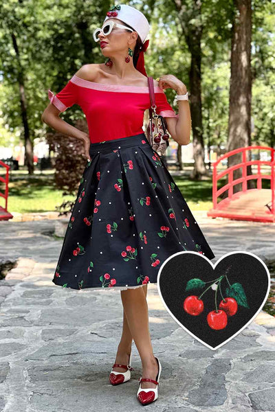 A model wearing a Carolyn Polka Dot Cherry Black Flared Skirt