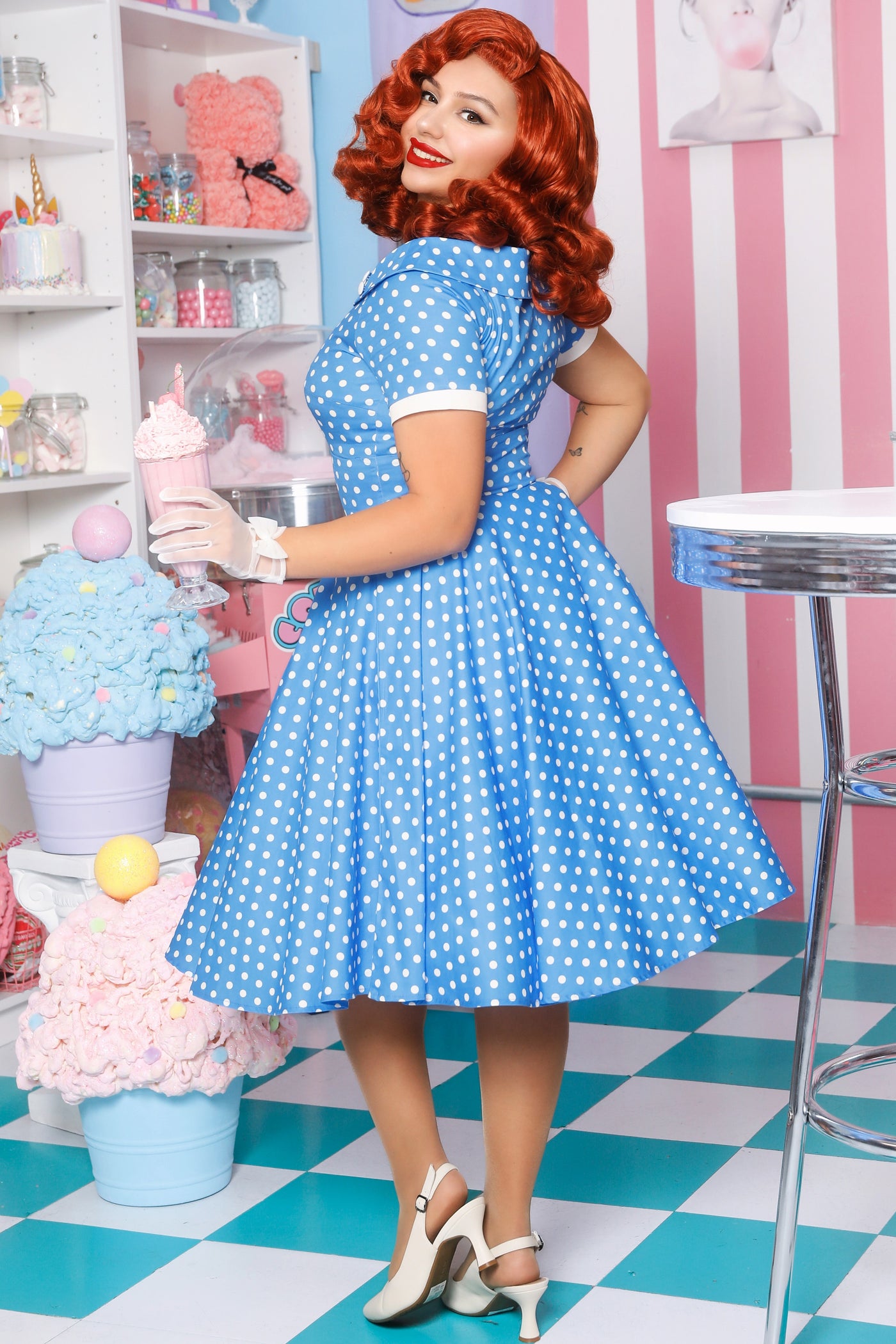 A model wearing a  Polka Dot Circle Dress In Sky Blue