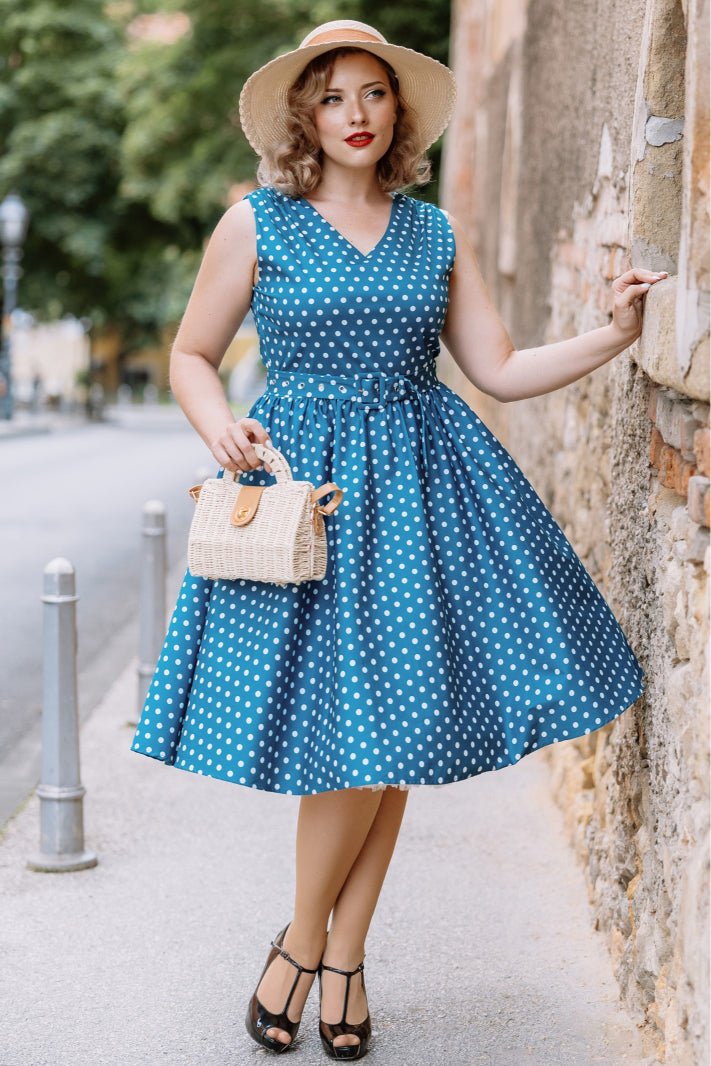 A model wearing a Polka Dot Rockabilly Swing Dress in Teal