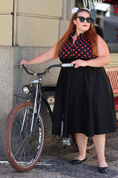 A lady wearing a Polka Dot Shirt Dress in Black and Red