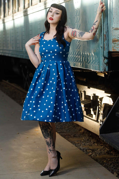 Front view of model wearing Polka Dot Swing Dress Peacock Blue & White