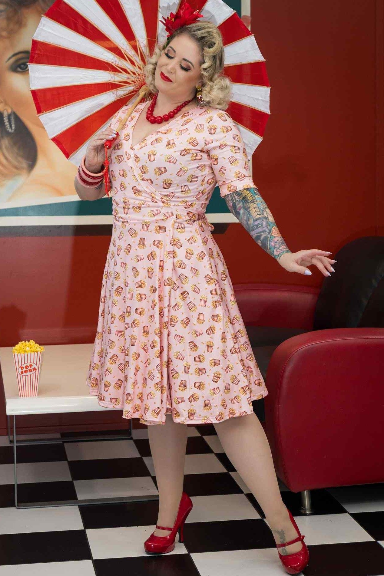 A model wearing Popcorn Wrap Dress In Light Pink