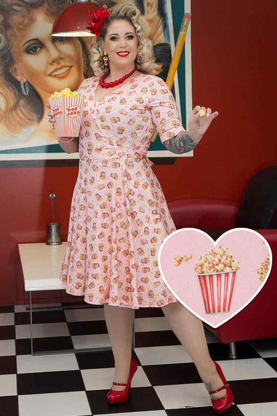 A model wearing Popcorn Wrap Dress In Light Pink