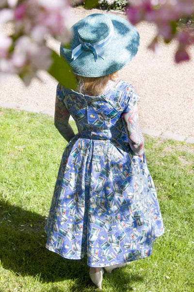 A model wearing Postage Stamp Off Shoulder Dress In Blue