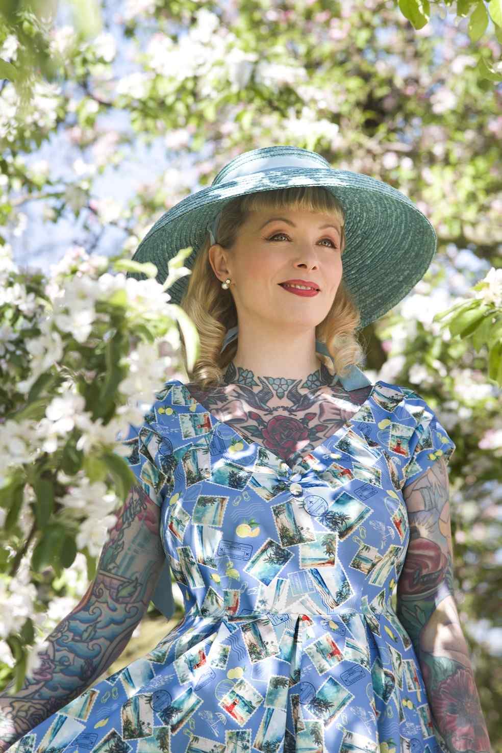 A model wearing Postage Stamp Off Shoulder Dress In Blue