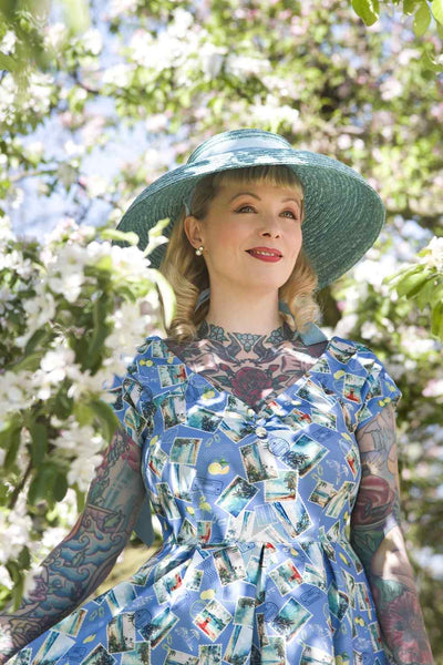A model wearing Postage Stamp Off Shoulder Dress In Blue
