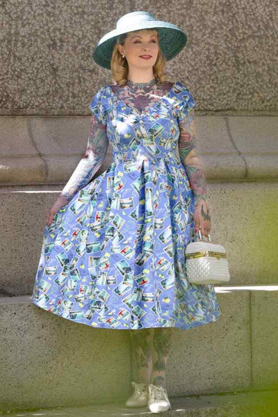 A model wearing Postage Stamp Off Shoulder Dress In Blue