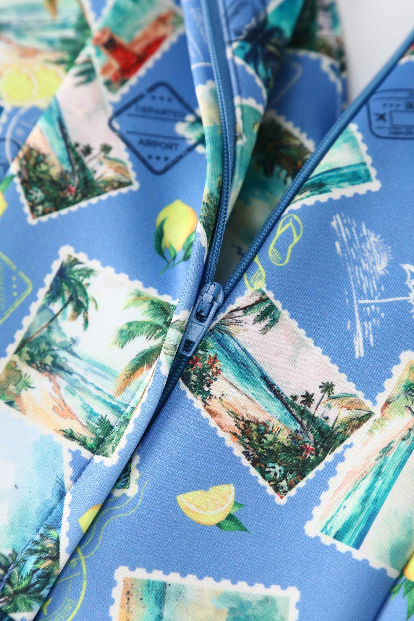 Close up view of Postage Stamp Off Shoulder Dress In Blue
