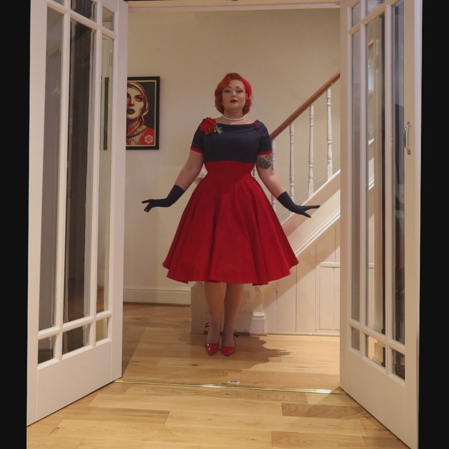 A video of Ms. BonnieRomanova_  wearing our  Darlene Navy & Burgundy Swing Dress.