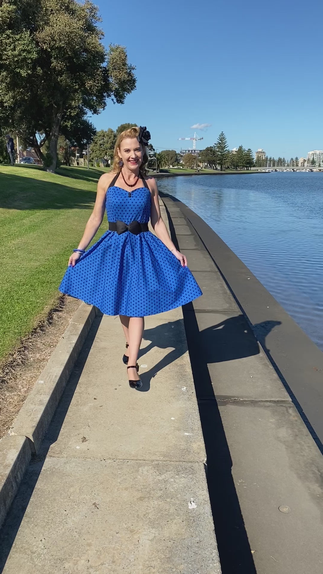 A video of Ms. kentuckyred wearing our Sophia Halter Neck Royal Blue Spot Dress.