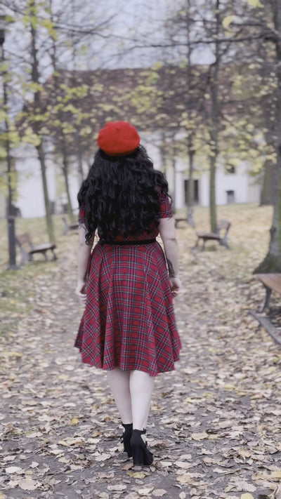 Video of a model walking  and twirling, wearing  our  Darlene Retro Highland, Red tartan Circle Dress.