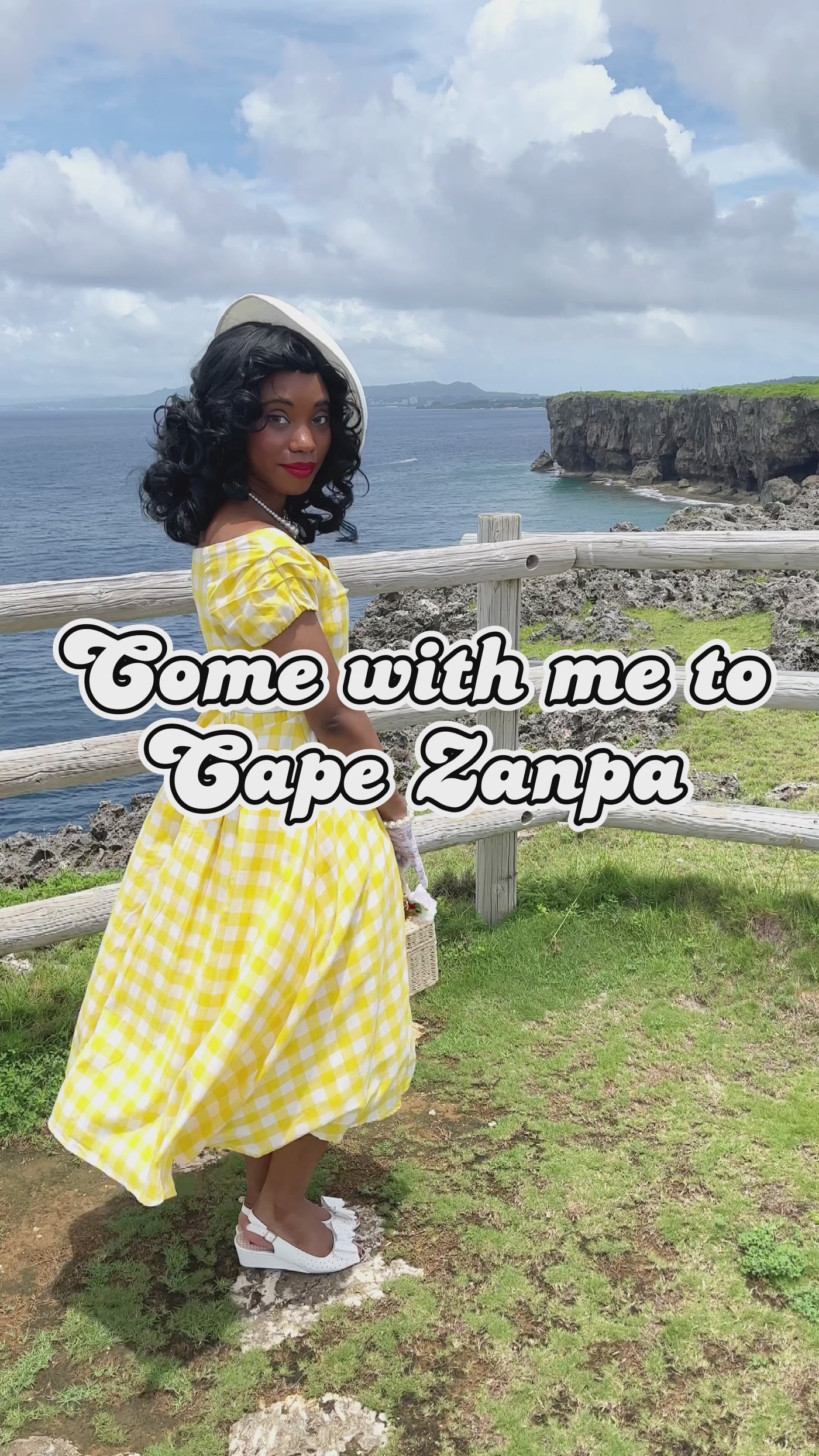 Video of a woman in a Lighthouse wearing a Yellow and White Gingham Dress.