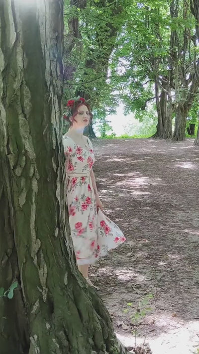 Video of Ms. @sippingrosetea in the forest wearing our  Lily Off Shoulder Floral Swing Dress In White.