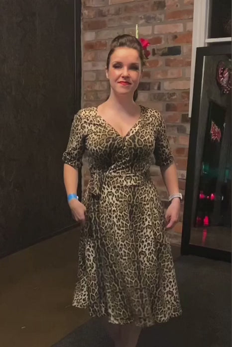 Video of a Model wearing our Leopard Print, Short-Sleeved Tea Dress.