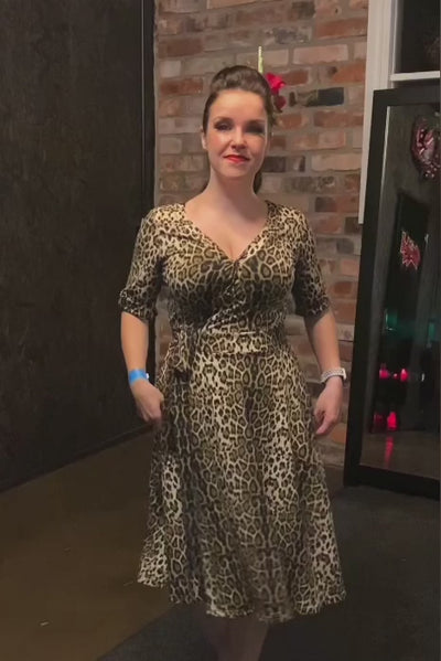 Video of a Model wearing our Leopard Print, Short-Sleeved Tea Dress.