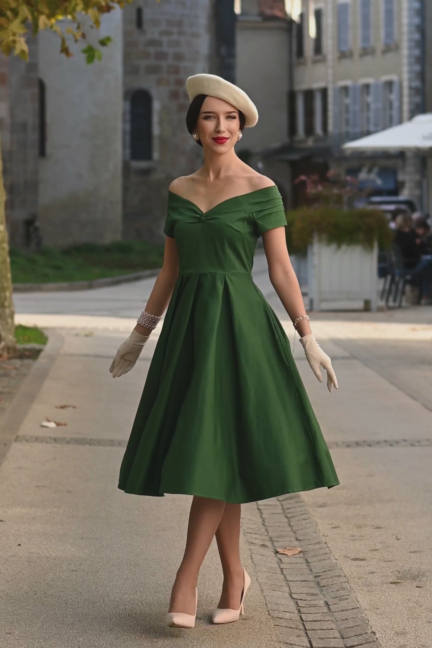 Video of A woman wearing a Lily Dark Green Off Shoulder Dress