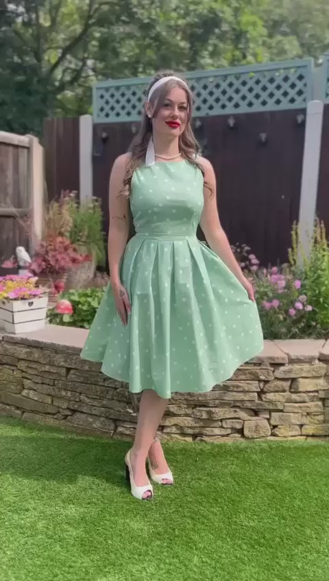Video of Ms. victory_vintage posing wearing our  Annie Retro Polka Dot Dress in Pale Green.