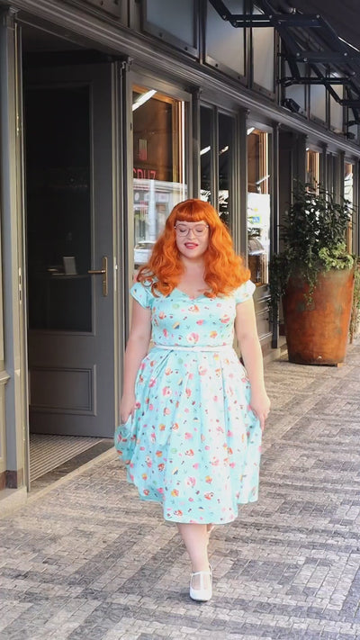 Video of Ms. bohuloo_gingergirl walking, wearing our  Lily Off Shoulder Dress In Pastel Afternoon Tea Cakes Print.