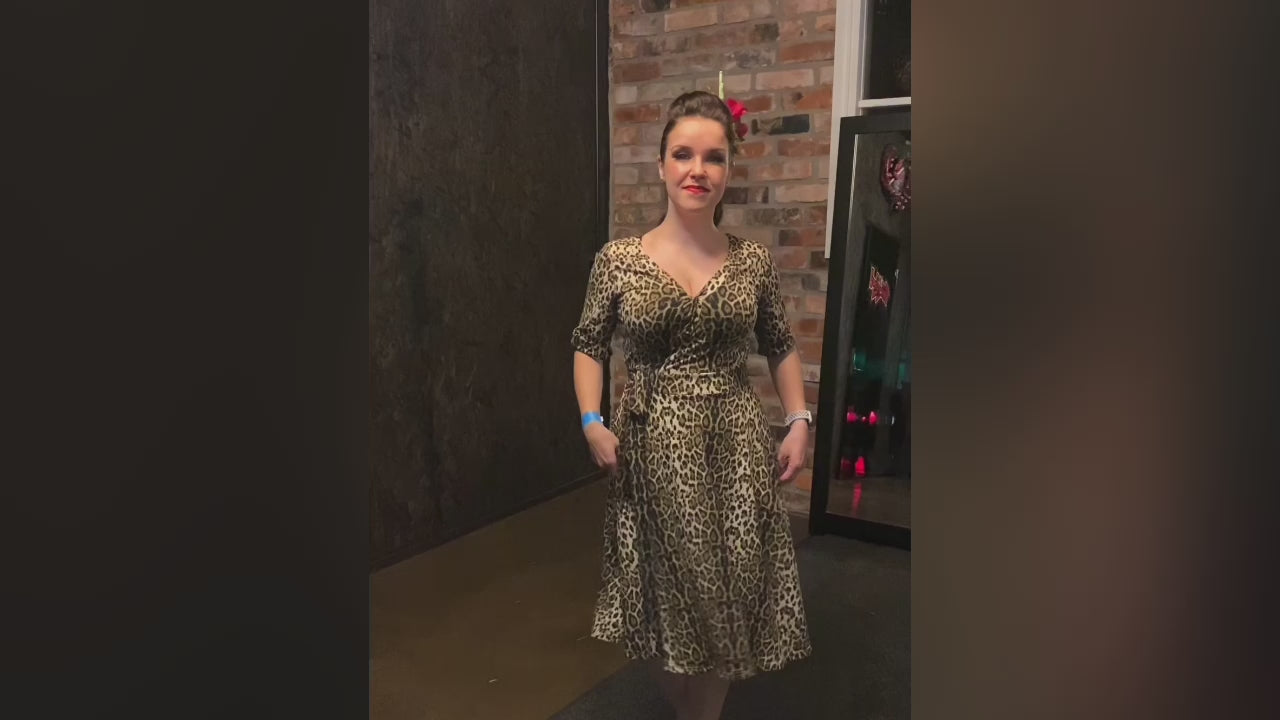 Video of a Model wearing our Leopard Print, Short-Sleeved Tea Dress.