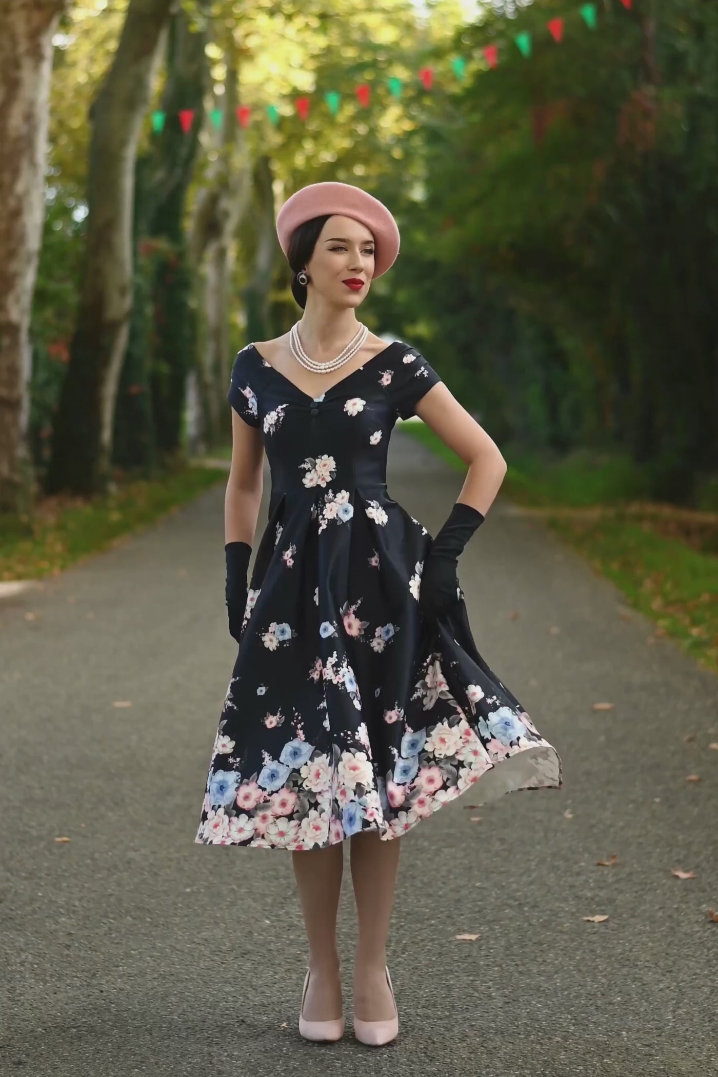 Video of A graceful model wearing a Lily Navy Blue Falling Rose Off Shoulder Dress