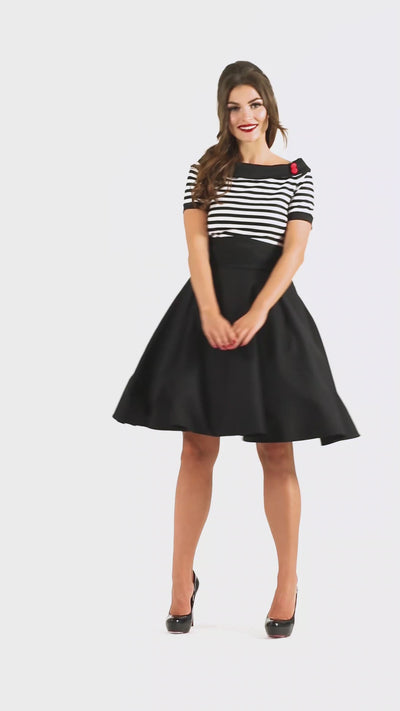 Video of a model wearing our Darlene Nautical Black & White Striped Dress.