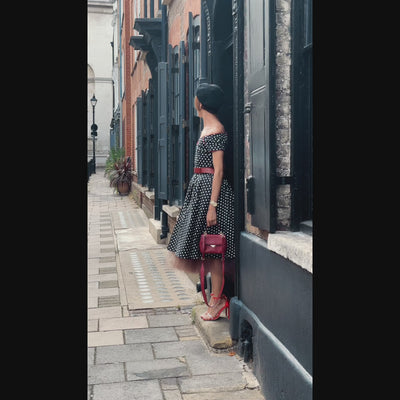 winktraveller-blogger wearing our Lily Off Shoulder Black & White Polka Swing Dress 