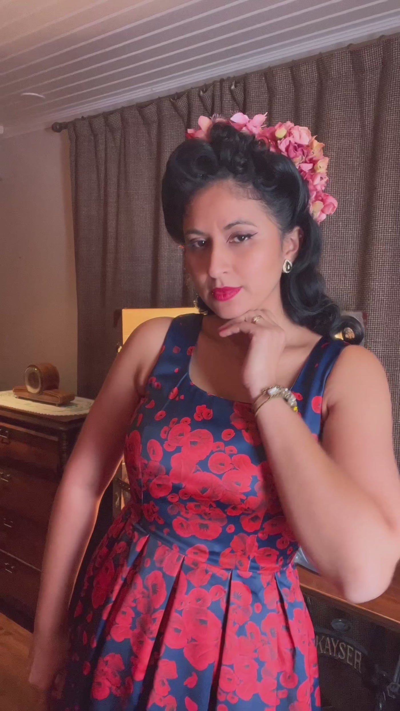 A video of Ms. linda_von_flames wearing our  Amanda 50s Inspired Swing Dress Navy with Poppy Flowers.
