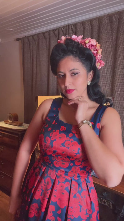 A video of Ms. linda_von_flames wearing our  Amanda 50s Inspired Swing Dress Navy with Poppy Flowers.