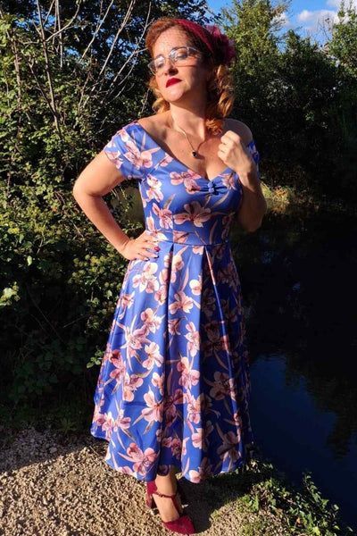 A model wearing a Purple Alstroemeria Off Shoulder Dress