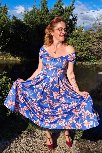 A model wearing a Purple Alstroemeria Off Shoulder Dress