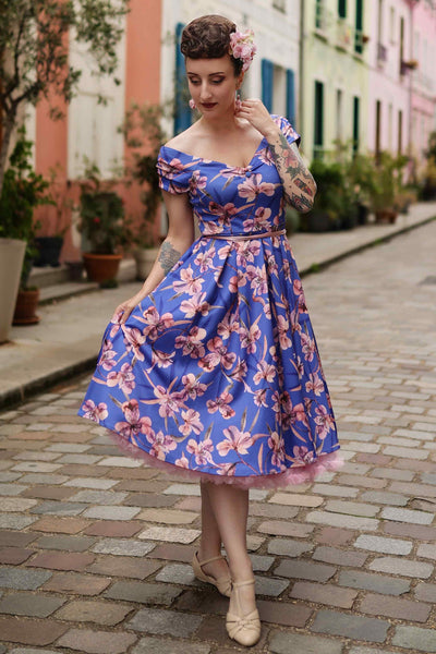 A model wearing Purple Alstroemeria Off Shoulder Dress
