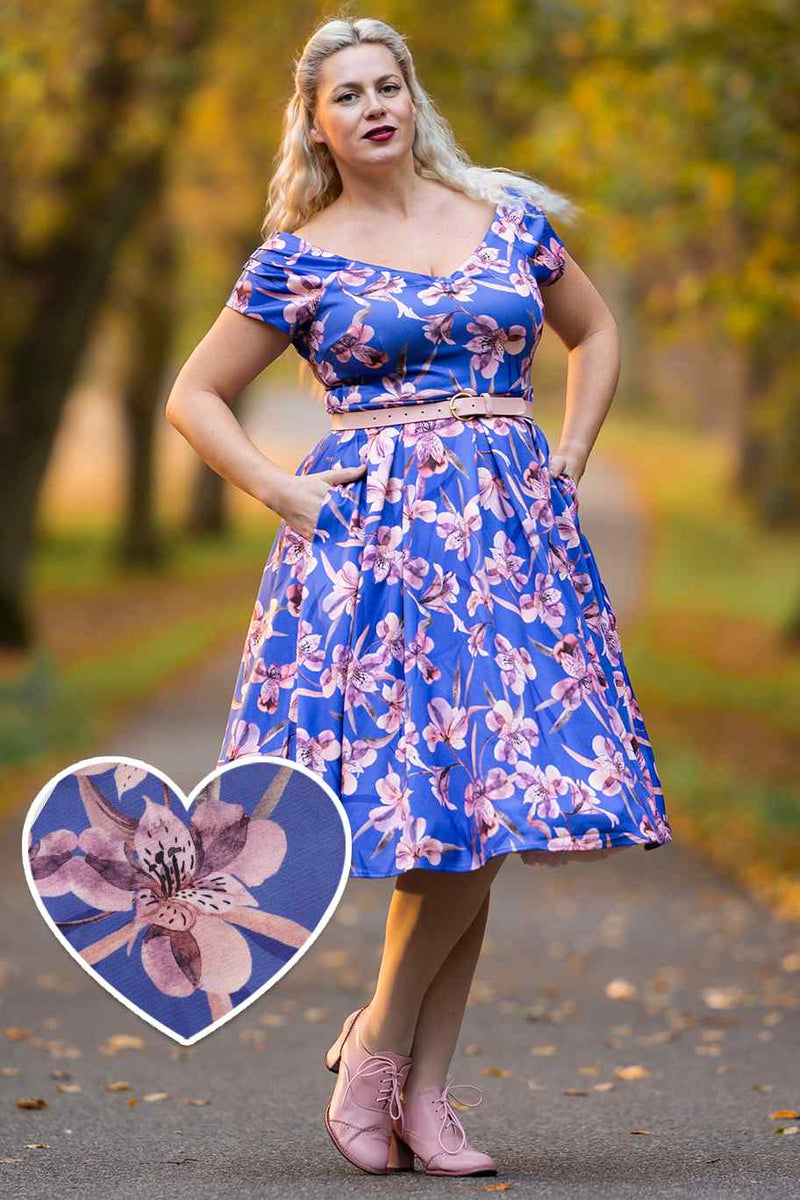 A lady wearing a Purple Alstroemeria Off Shoulder Dress