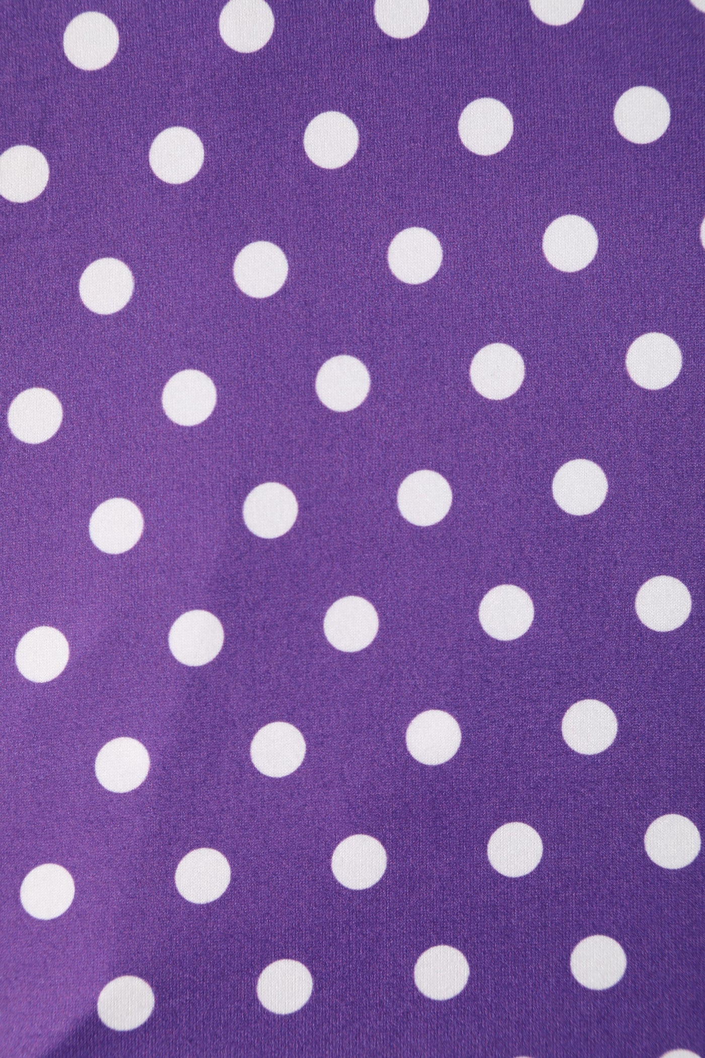 purple and white polka dot knit fabric