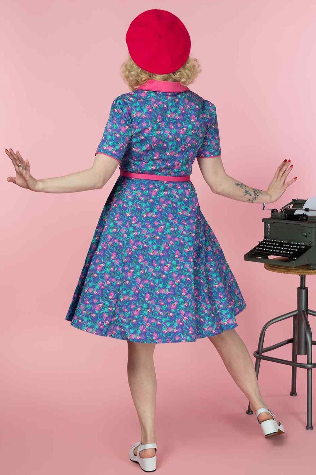 A model wearing a Purple Flamingo Shirt Dress