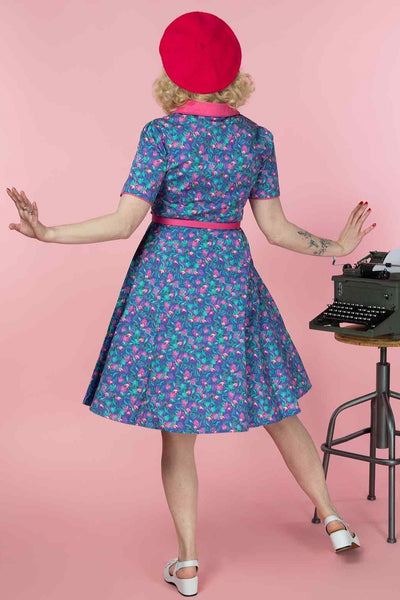A model wearing a Purple Flamingo Shirt Dress