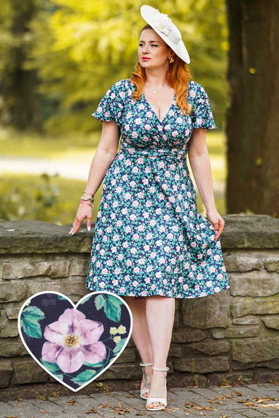A model wearing Purple Floral Crossover Bust Dress