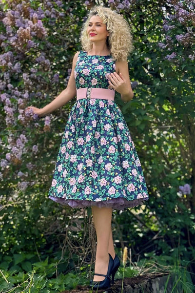 Model wearing a Purple Floral Swing Dress
