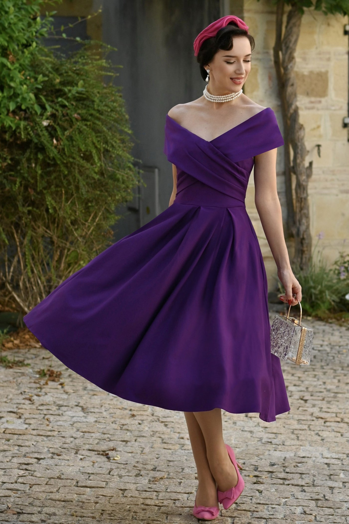 A lovely model wearing a Purple Off Shoulder Dress