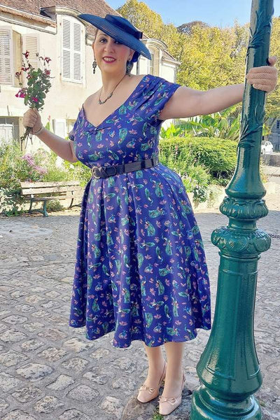 A woman wearing a Lily Purple Peacock Circle Dress