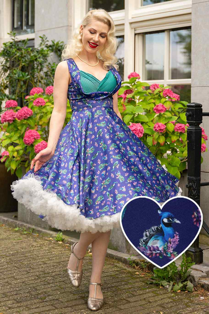 A model wearing a Purple Peacock Pleated Bust Dress