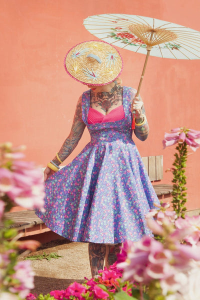 A model wearing Purple Pleated Dress in Flamingo Leaf Print