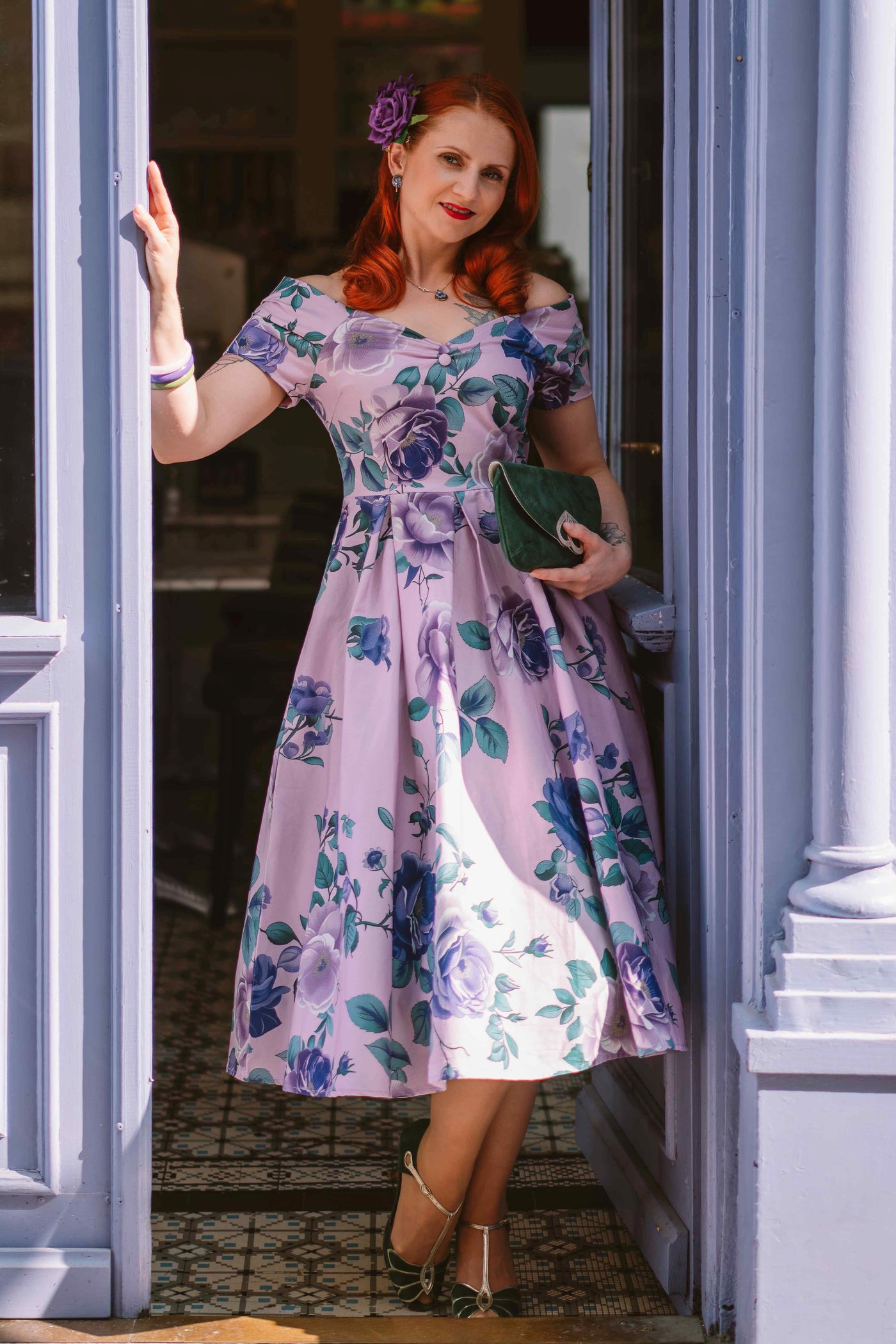 A model wearing a Lily Purple Rose Off Shoulder Midi Dress