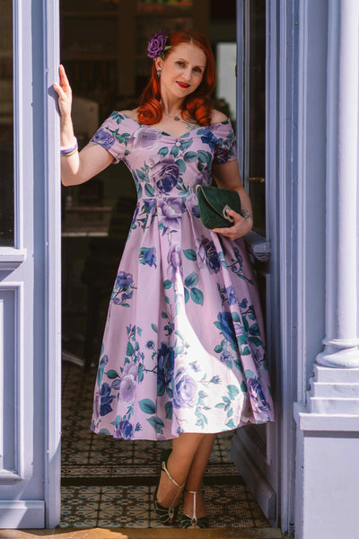 A model wearing a Lily Purple Rose Off Shoulder Midi Dress