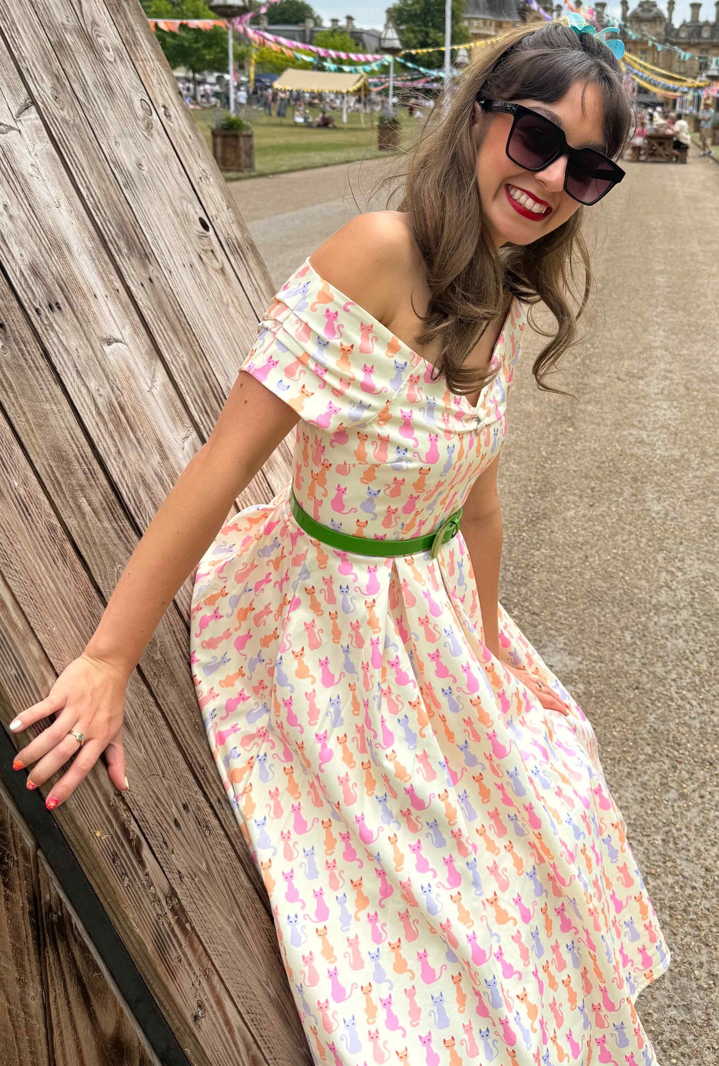 A woman wearing the Rainbow Cat White Short Sleeve Swing Dress