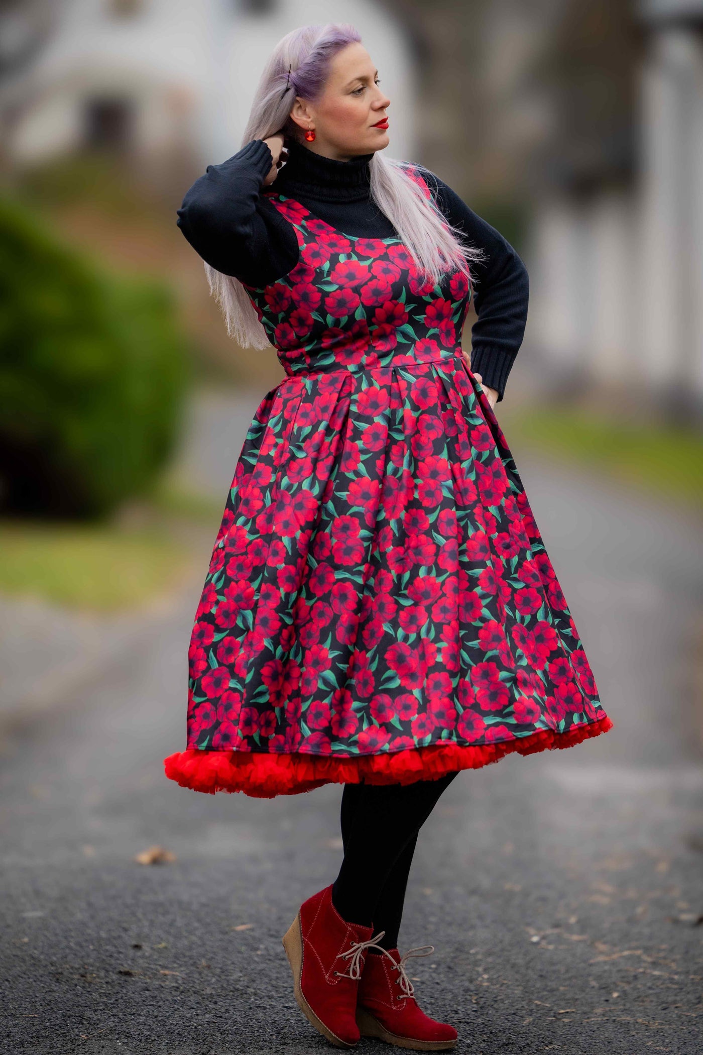 A lady wearing a Red Anemone Swing Dress