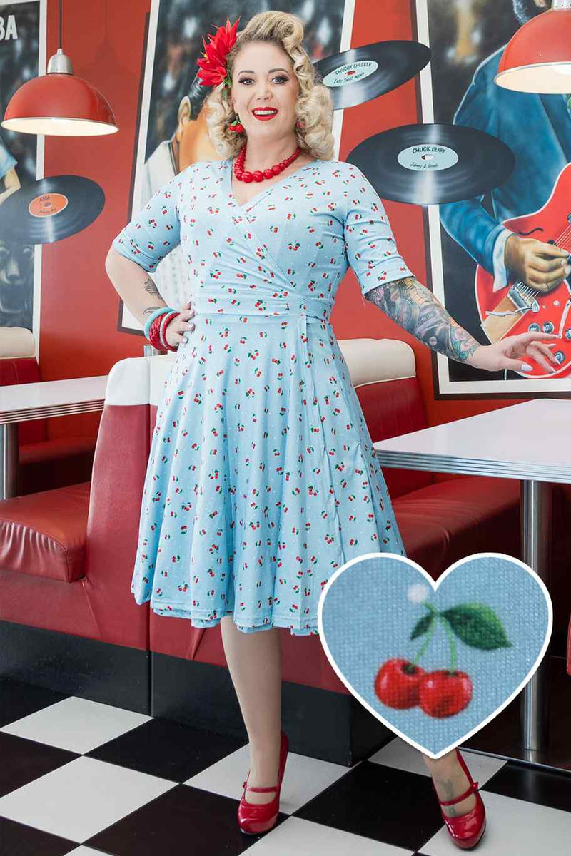 A model wearing Red Cherry Blue Wrap Dress