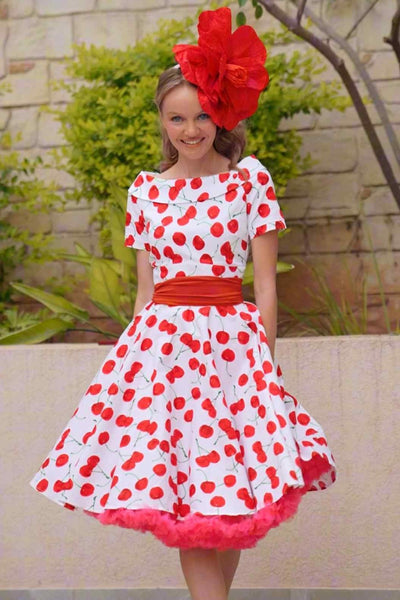 A lady wearing a Red Cherry Dress In White